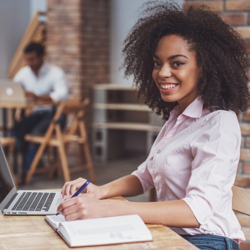 Beautiful Afro-American woman working