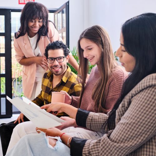 Group of diverse colleagues discussing project